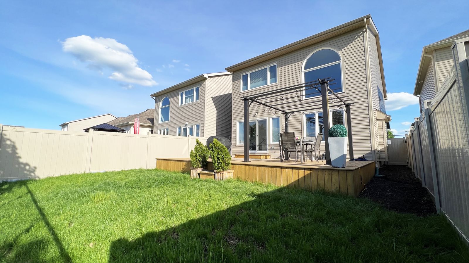 Backyard deck with pergola and no rear neighbours