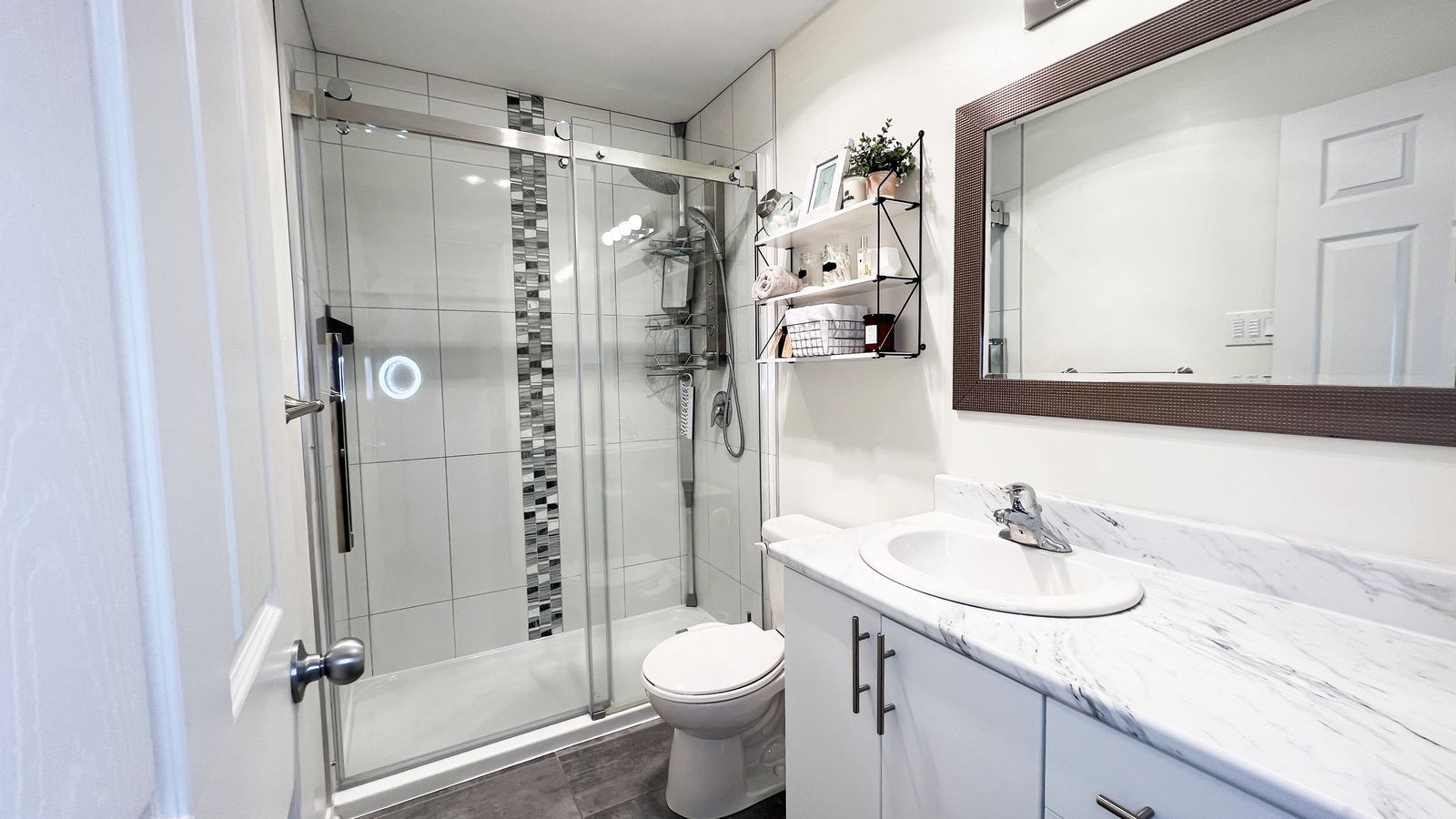 Primary ensuite with custom tiled shower
